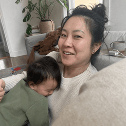 Mei, a Compass beta tester, with her child